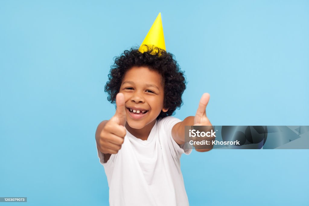 Thumbs Up To Birthday Party Excited Amazing Joyful Little Boy With Funny  Cone On Head Showing Like Gesture Stock Photo - Download Image Now - iStock