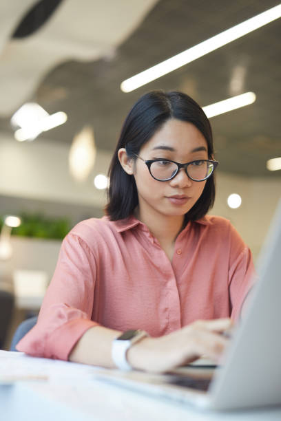 istock Asian Businesswoman using Laptop 1203080773