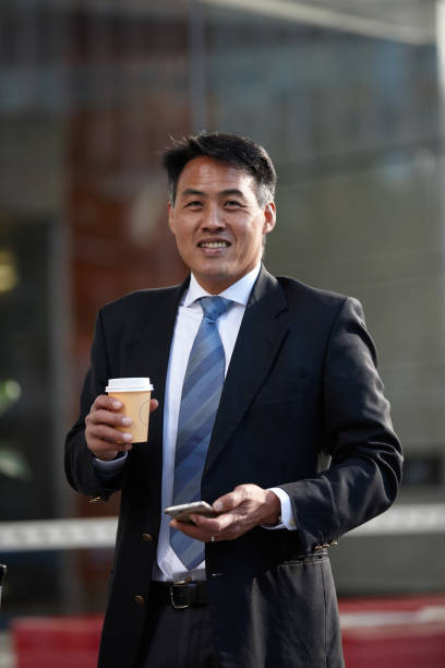 istock Australasian businessman using mobile phone 1203082830