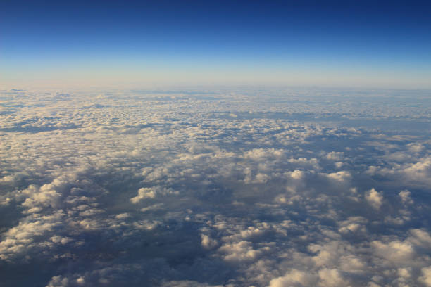 istock the blue sky and cloud from air view 1203083374