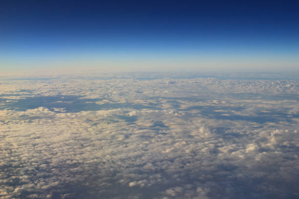 istock the blue sky and cloud from air view 1203083375