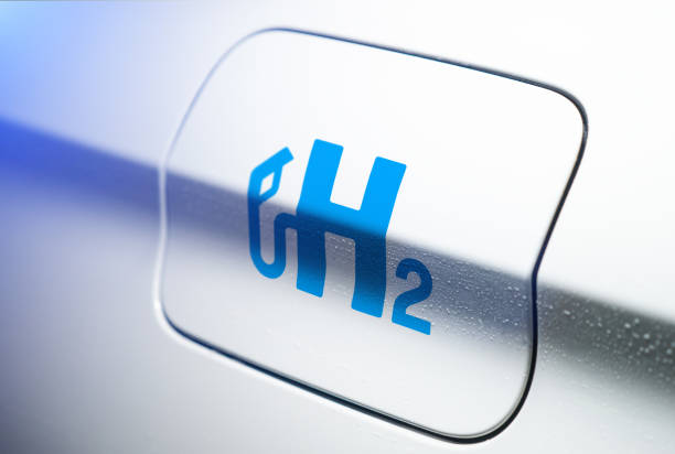 Car with hydrogen logo on filler cap. h2 combustion engine for emission free ecofriendly transport. Car with hydrogen logo on filler cap. h2 combustion engine for emission free ecofriendly transport. hydrogen photos stock pictures, royalty-free photos & images