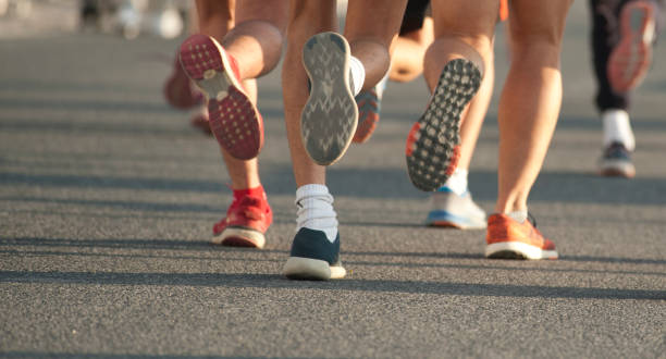 istock race runners with blue and red shoes 1203089656