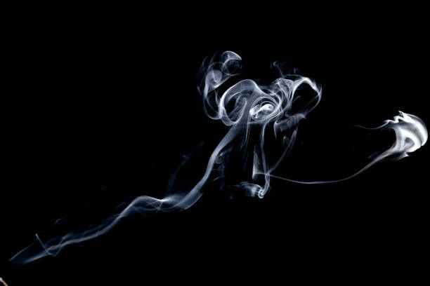 istock blue smoke isolated on a black background. template for design 1203089776