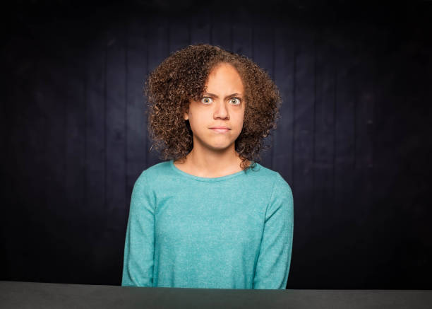 istock Pretty Young Girl with Angry Expression 1203089790