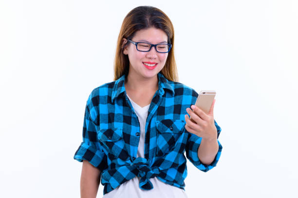 istock Happy young beautiful Asian hipster woman using phone 1203092903