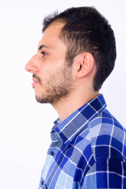 istock Closeup profile view of young bearded Persian hipster man 1203093013