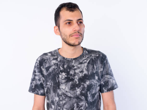 istock Face of young bearded Persian man thinking and looking away 1203093024