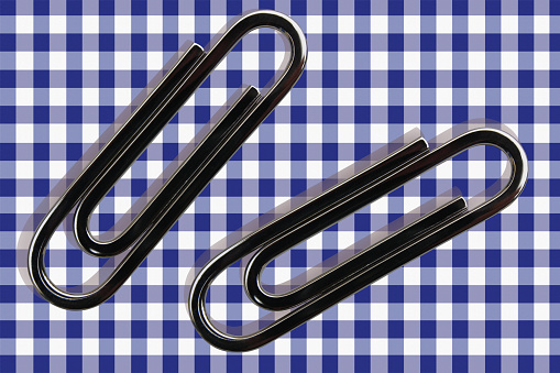 Colored paper clips on white background.