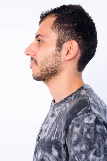 istock Closeup profile view of young bearded Persian man 1203097454