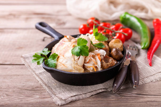istock Chicken fillet, cabbage and mushrooms lunch. Selective focus. Copy space. 1203099957