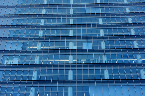 Close-up of abstract modern office building windows background.