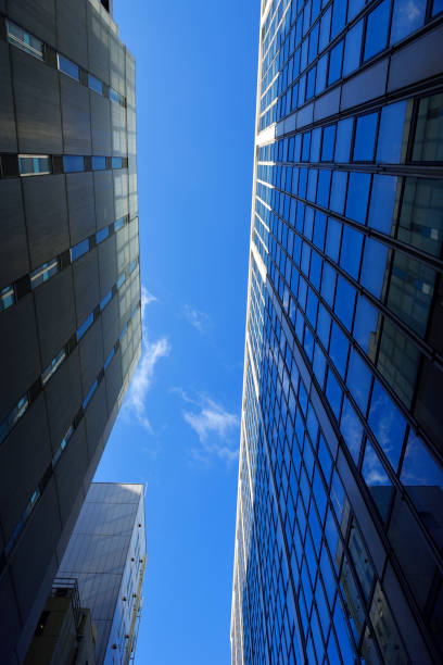 istock Low angle view of modern office buildings against clear sky 1203100243