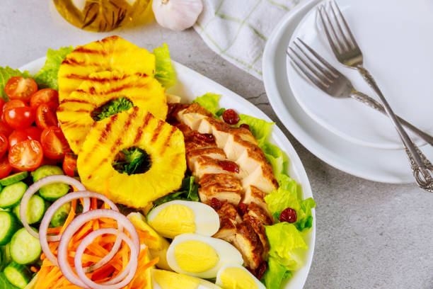 istock Tasty salad with olive oil and plate with fork. 1203108958