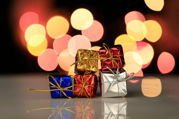 istock Christmas gifts and abstract background light 1203109879