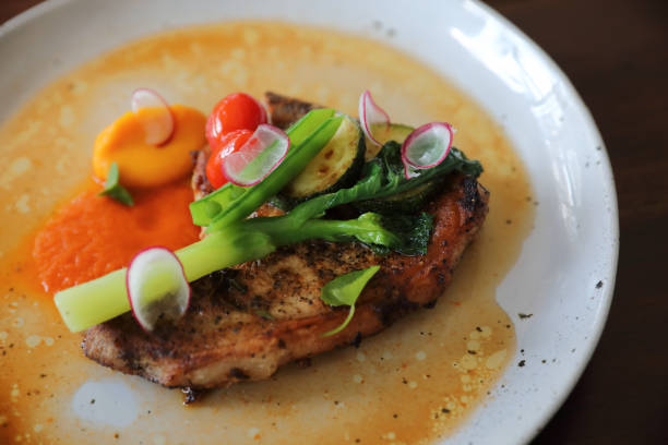 istock Grilled Porkchop and vegetables on top on wood background 1203110592