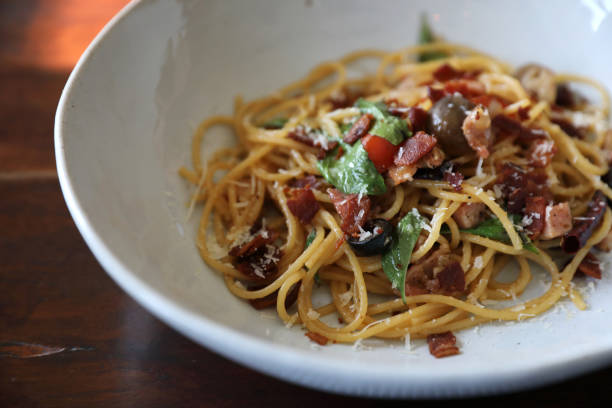 istock Dried Chili and Bacon Spaghetti on wood background 1203111644