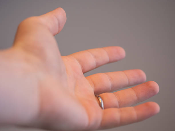 istock A hand of a married man making a welcoming gesture 1203116552