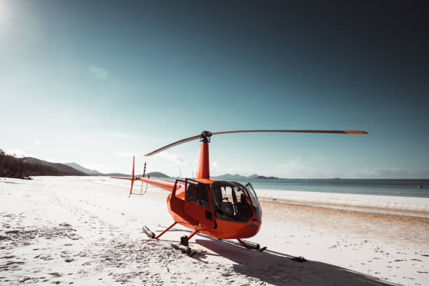helicóptero estacionado en la playa whitsunday en australia - unesco world heritage site cloud day sunlight fotografías e imágenes de stock