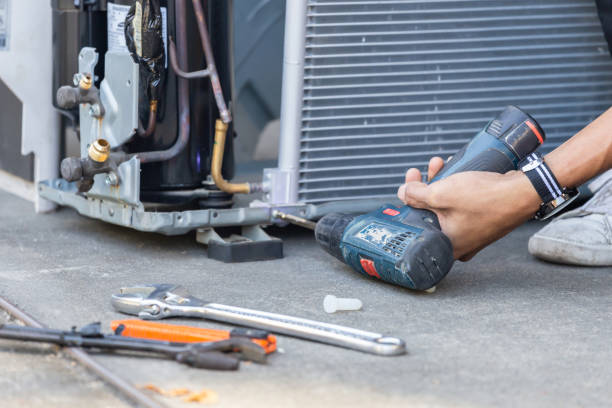 selective focus air conditioning repair, technician man hands using a screwdriver fixing modern air conditioning system - manual worker one person young adult men imagens e fotografias de stock