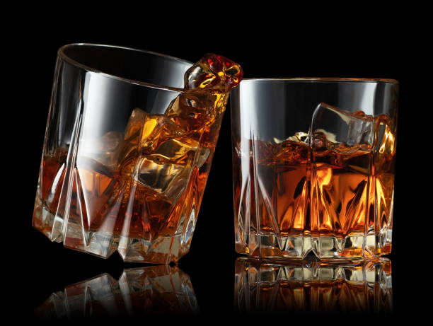 istock glasses of whiskey making toast 1203119661