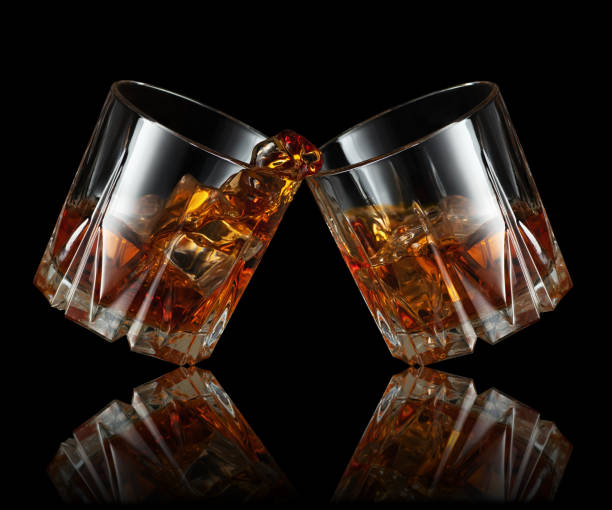 istock glasses of whiskey making toast 1203119667