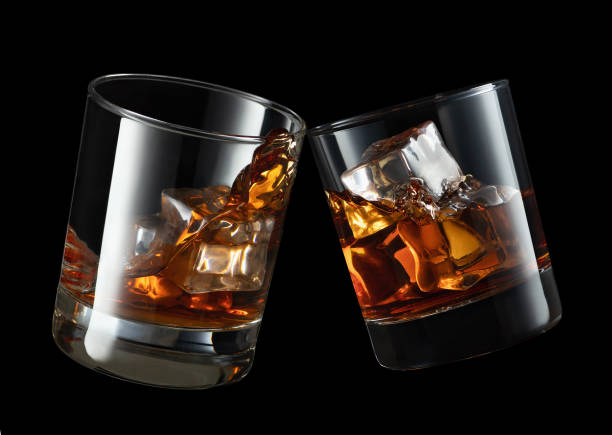 istock glasses of whiskey making toast 1203119679