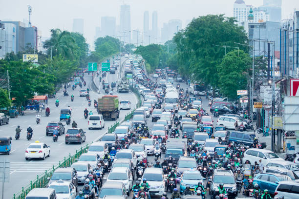 Aerial view of traffic jam with crowded vehicles JAKARTA - Indonesia. August 27, 2019: Aerial view of traffic jam with crowded vehicles in Jakarta city jakarta stock pictures, royalty-free photos & images