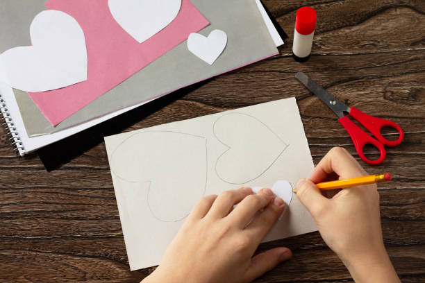 istock Step 2 instruction. Greeting card with mouse heart congratulation. Children's art project crafts for children. Craft for children. 1203122316