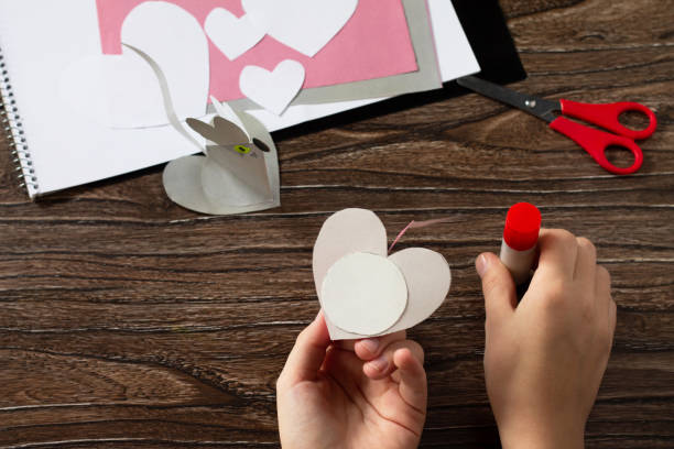 istock Step 10 instruction. Greeting card with mouse heart congratulation. Children's art project crafts for children. Craft for children. 1203122319