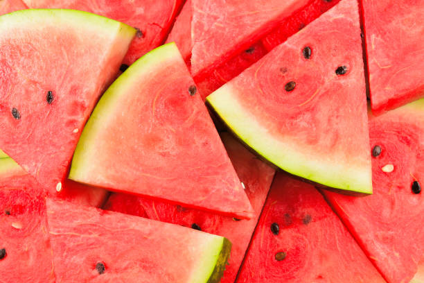 istock Juicy watermelon slices background. Top view. 1203122971