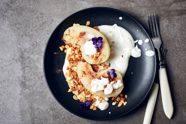 istock Poached pear with yogurt  and granola. 1203123481