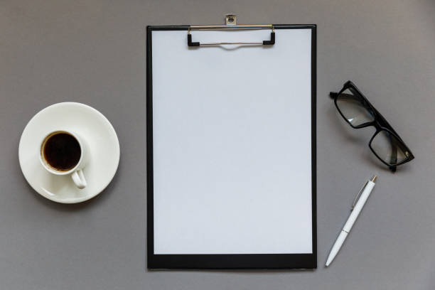 istock Workplace for office work. Flute, gray background with notebook, pen and cup of coffee 1203125515