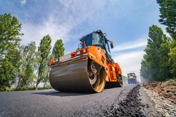 Road repair, compactor lays asphalt.