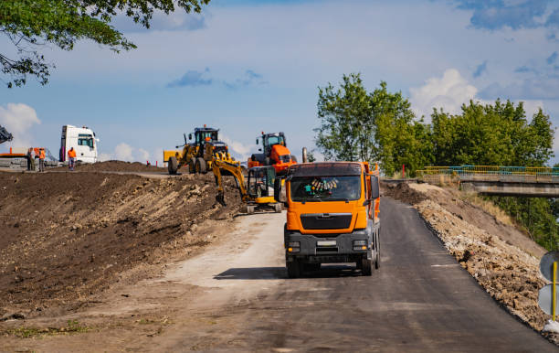 istock Industrial dumper trucks working on highway construction site 1203126627