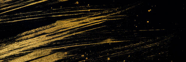 istock Golden curved lines on a black background. 1203131140