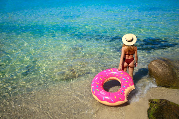 istock Young woman on a tropical beach 1203134976