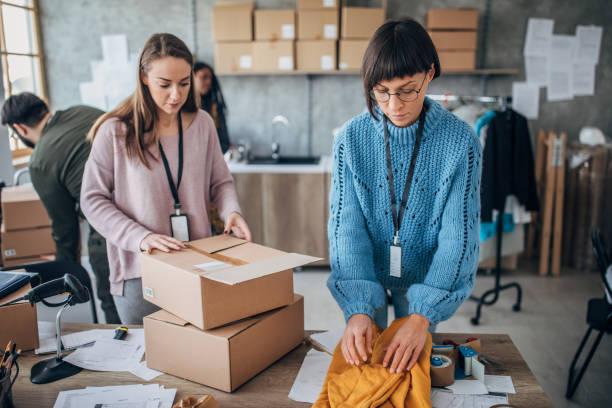 istock Diverse group of people arranging customers orders for drop shipping 1203135035