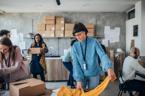 istock Diverse group of people arranging customers orders for drop shipping 1203136219