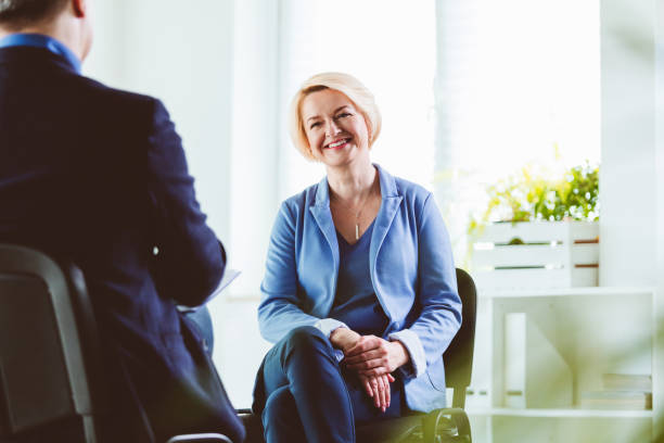 istock Businesswoman talking to coach during session 1203138694
