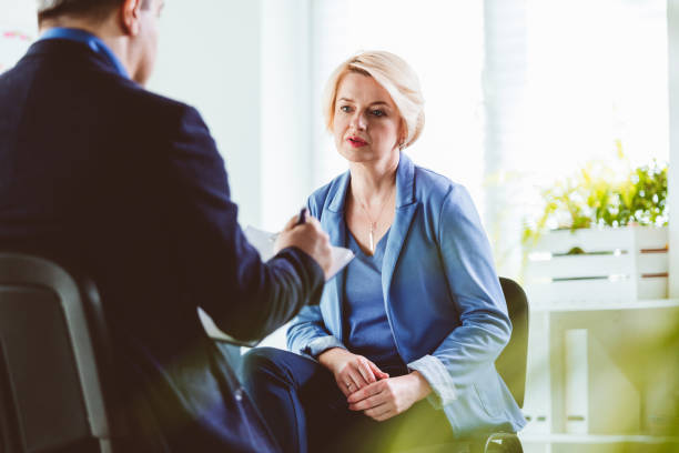 istock Businesswoman talking to coach during session 1203138871