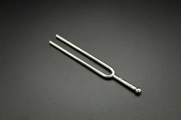 Photo of a tuning fork 440 Hz on a black background