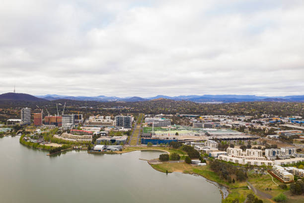 Aerial view of Belconnen town centre in Canberra, the capital of Australia Aerial view of Belconnen town centre and Lake Ginninderra on a cloudy day in Canberra, the capital of Australia belconnen stock pictures, royalty-free photos & images