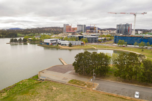 Aerial view of Belconnen town centre in Canberra, the capital of Australia Aerial view of Belconnen town centre and Lake Ginninderra on a cloudy day in Canberra, the capital of Australia belconnen stock pictures, royalty-free photos & images