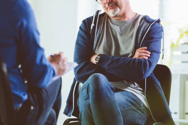 istock Sad man talking listening to psychotherapist during session 1203141128