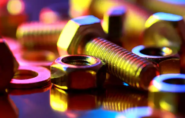 Screws, nuts, washers, close-up.