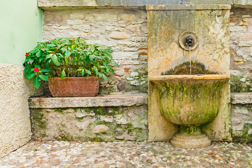 Square with ancient fountain. Rovereto, Italy