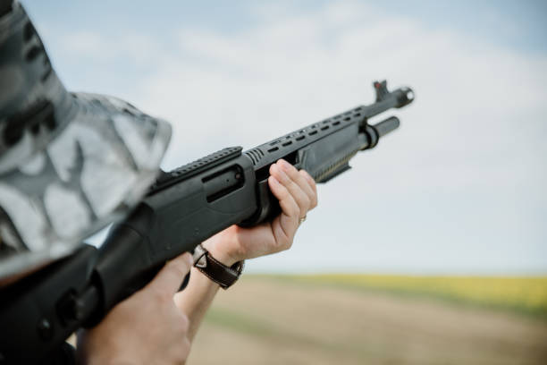 istock Male hunter aiming his rifle and preparing to shoot 1203143572
