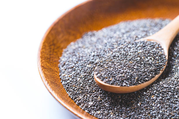 istock Bowl with chia seeds and wooden spoon 1203148742