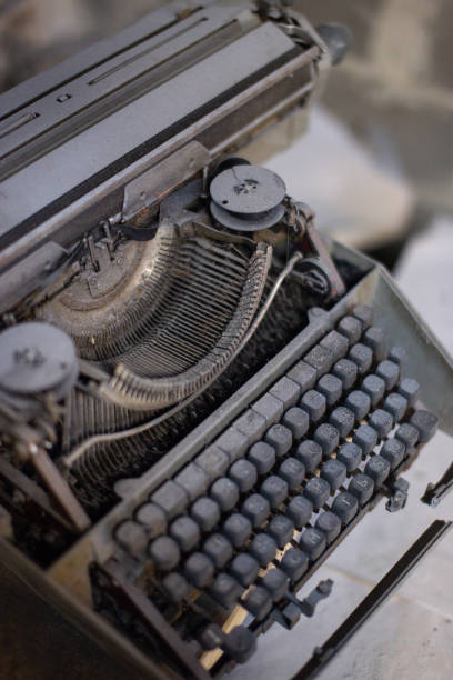 istock Old, antique typewriter close-up in the dust. 1203149955